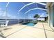 Enjoy water views from this enclosed lanai with a pool and patio at 3772 Peace River Dr, Punta Gorda, FL 33983