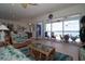 Cozy living room with waterfront views, comfortable seating, and tropical decor at 3772 Peace River Dr, Punta Gorda, FL 33983