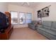 This cozy living room offers natural light, comfortable seating and entertainment options for relaxation and enjoyment at 3772 Peace River Dr, Punta Gorda, FL 33983