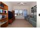Cozy Living room with a TV, bookshelves, and comfortable seating offering a relaxing atmosphere at 3772 Peace River Dr, Punta Gorda, FL 33983
