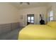 Bright main bedroom featuring neutral walls, carpet and a large bed with closet at 3772 Peace River Dr, Punta Gorda, FL 33983