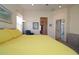 Bright main bedroom featuring neutral walls, carpet and a large bed with reading chair at 3772 Peace River Dr, Punta Gorda, FL 33983