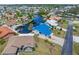 Waterfront home with a blue metal roof, private boat dock, and stunning canal access at 3825 Barnegat Dr, Punta Gorda, FL 33950