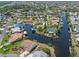 Stunning aerial view of a waterfront community with canals and many blue metal roofs at 3825 Barnegat Dr, Punta Gorda, FL 33950