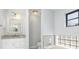 Bright bathroom featuring a granite countertop, white vanity, and shower-tub combination at 3825 Barnegat Dr, Punta Gorda, FL 33950