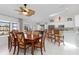 Spacious dining area featuring a wooden table, bar seating, and views of the water at 3825 Barnegat Dr, Punta Gorda, FL 33950