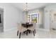 Dining room with a chandelier, window view and seating for four at 3825 Barnegat Dr, Punta Gorda, FL 33950