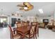 Open concept floor plan featuring a dining room and kitchen with a stainless steel fridge at 3825 Barnegat Dr, Punta Gorda, FL 33950