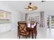 Dining area with a bay window, ceiling fan, and seating for six at 3825 Barnegat Dr, Punta Gorda, FL 33950