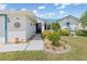 Inviting home exterior with lush landscaping and a welcoming front entrance at 3825 Barnegat Dr, Punta Gorda, FL 33950