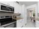 Modern kitchen features granite countertops and stainless steel appliances at 3825 Barnegat Dr, Punta Gorda, FL 33950