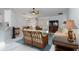 Bright living room with neutral colors, ceiling fan, and comfortable seating at 3825 Barnegat Dr, Punta Gorda, FL 33950