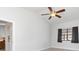 Bright bedroom with ceiling fan and two windows bringing in natural light at 3825 Barnegat Dr, Punta Gorda, FL 33950