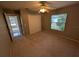 This neutral bedroom offers a double closet, carpet, and bright window at 4205 Simkins Ave, North Port, FL 34286