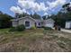 Charming single-story home with well-maintained landscaping and a welcoming front yard, showcasing curb appeal at 4205 Simkins Ave, North Port, FL 34286