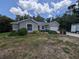 Charming home exterior features well-maintained landscaping and an attached two-car garage at 4205 Simkins Ave, North Port, FL 34286