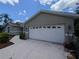 Spacious two-car garage with a clean, modern design and ample parking space on the paved driveway at 4205 Simkins Ave, North Port, FL 34286