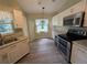 Modern kitchen features white cabinetry, granite countertops and stainless steel appliances at 4205 Simkins Ave, North Port, FL 34286