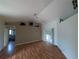 A bright living room with sliding doors to the outside, and a ceiling fan at 4205 Simkins Ave, North Port, FL 34286