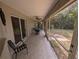 This screened-in patio is perfect for outdoor dining and relaxation with views of the backyard at 4205 Simkins Ave, North Port, FL 34286