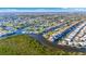 Overhead view of a waterfront community with connecting canals, mangroves and stunning blue skies at 4426 Vasco St, Punta Gorda, FL 33950