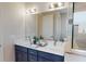 Modern bathroom showcasing a double vanity with marble countertop and decorative mirrors at 4426 Vasco St, Punta Gorda, FL 33950