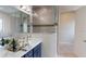 Open bathroom space with dual sinks, a tiled shower and a spacious design at 4426 Vasco St, Punta Gorda, FL 33950