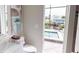Bathroom offering views to a pool and lanai at 4426 Vasco St, Punta Gorda, FL 33950