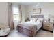 Cozy bedroom with a comfortable bed, soft lighting, and calming neutral tones at 4426 Vasco St, Punta Gorda, FL 33950