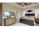 Comfortable bedroom featuring tray ceilings, a large mirror and natural light at 4426 Vasco St, Punta Gorda, FL 33950