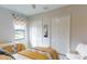 Comfortable bedroom featuring two beds, ample closet space, and a cozy accent chair at 4426 Vasco St, Punta Gorda, FL 33950