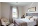 Comfortable bedroom featuring a bed, soft lighting, and calming neutral tones and decor at 4426 Vasco St, Punta Gorda, FL 33950