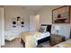 Charming bedroom with two twin beds, accent chair, and stylish decor elements at 4426 Vasco St, Punta Gorda, FL 33950