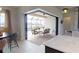 Dining area with sliding glass doors leading to screened in lanai and outdoor seating at 4426 Vasco St, Punta Gorda, FL 33950