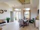 Inviting dining area with modern chandelier, stylish furnishings, and plenty of natural light at 4426 Vasco St, Punta Gorda, FL 33950