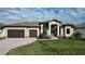 Beautiful single-story home with a two-car garage, tile roof and well-manicured lawn at 4426 Vasco St, Punta Gorda, FL 33950