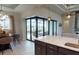Open kitchen and dining area showcasing sliding glass doors leading to the outdoor patio and pool at 4426 Vasco St, Punta Gorda, FL 33950