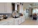 Modern kitchen featuring ample cabinetry, an eat-in space, and stainless steel appliances at 4426 Vasco St, Punta Gorda, FL 33950