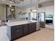 Modern kitchen featuring an eat-in kitchen island, stainless steel appliances, and an adjacent living space at 4426 Vasco St, Punta Gorda, FL 33950