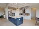 Bright kitchen featuring a spacious island, stainless steel appliances, and elegant pendant lighting at 4426 Vasco St, Punta Gorda, FL 33950