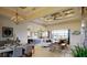 Open-concept living room with modern furnishings, dining area and sliding glass doors at 4426 Vasco St, Punta Gorda, FL 33950