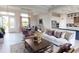 Bright and airy living room with modern decor, comfortable seating, and an open layout flowing into the dining area at 4426 Vasco St, Punta Gorda, FL 33950