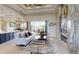 Well-lit living area with contemporary decor, fireplace, and a view of the outdoor pool at 4426 Vasco St, Punta Gorda, FL 33950