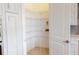 Organized walk-in pantry with wire shelving providing ample storage space and easy access to food items at 4426 Vasco St, Punta Gorda, FL 33950