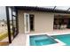 Screened pool with spa, dining and kitchen area, accessible from inside the home at 4426 Vasco St, Punta Gorda, FL 33950