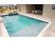 Inviting screened in pool with spa and an outdoor dining area at 4426 Vasco St, Punta Gorda, FL 33950