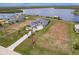 A serene aerial shot of a luxurious waterfront residence boasting a private dock and expansive grounds at 5061 Collingswood Blvd, Port Charlotte, FL 33948