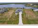 Stunning aerial view of a sprawling estate showcasing the meticulously landscaped grounds and waterfront access at 5061 Collingswood Blvd, Port Charlotte, FL 33948