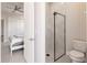 Contemporary bathroom with glass-enclosed shower, toilet, and ceiling fan at 5061 Collingswood Blvd, Port Charlotte, FL 33948