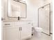 Modern bathroom featuring a sleek vanity, large mirror, and glass-enclosed shower at 5061 Collingswood Blvd, Port Charlotte, FL 33948